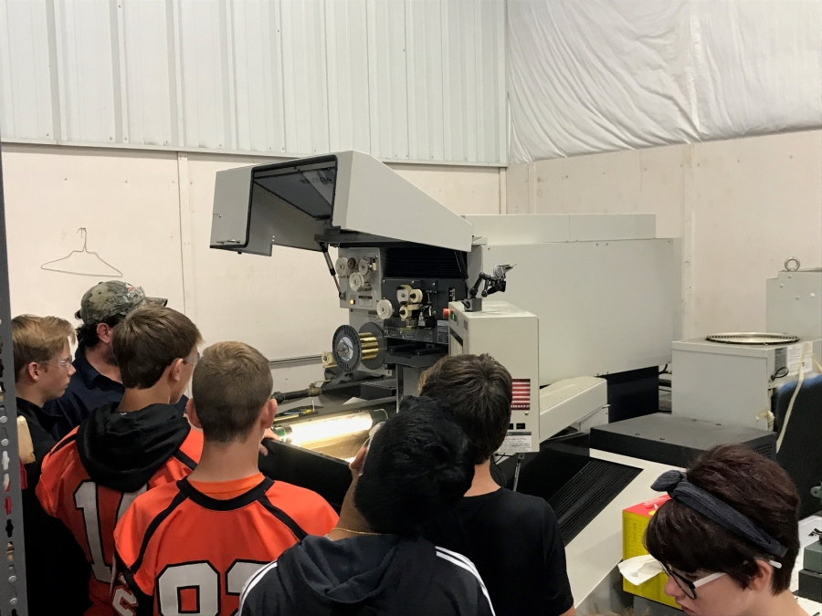 kids looking at a piece of equipment